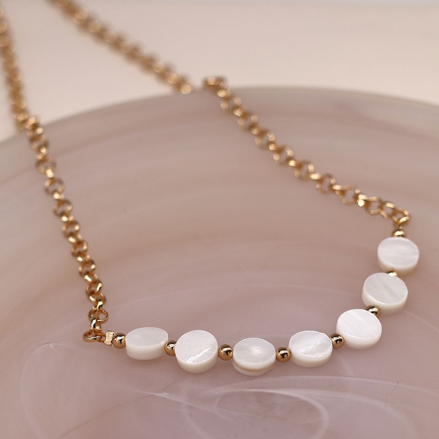 Golden chain and pearl disc necklace