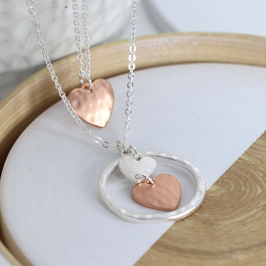 Silver and rose gold triple heart and hoop layer necklace